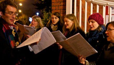 Christmas night - carols at church door