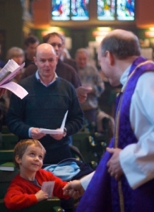 Bishop Paul greets a little boy